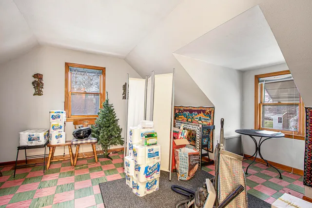 a view of a livingroom with furniture and workspace