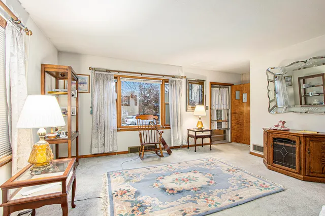 a living room with furniture and a table