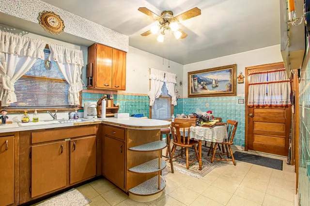 a kitchen with a cabinets and chairs