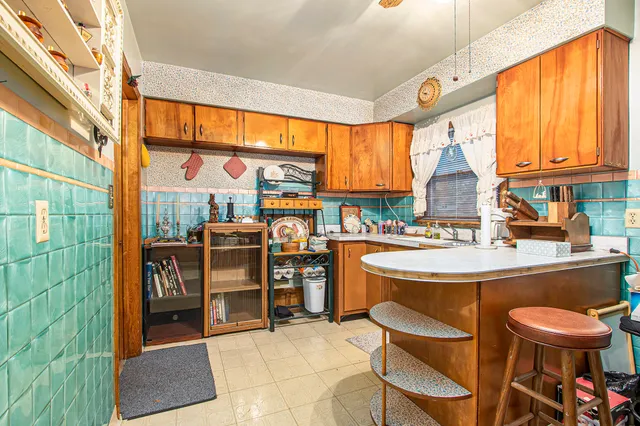 a kitchen with a sink and a stove top oven