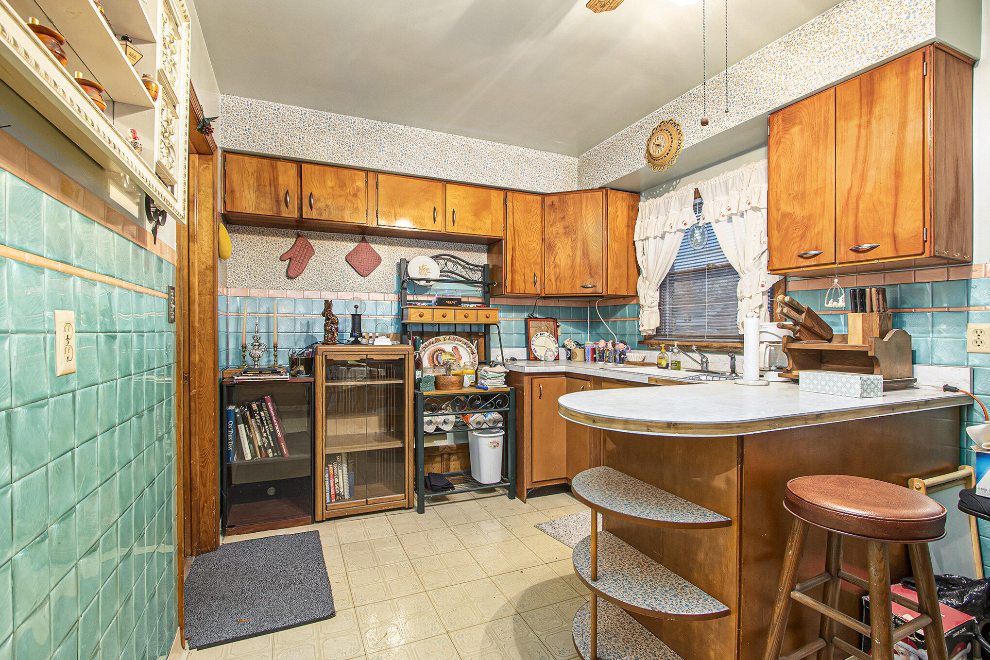 1027 Spruce Street Hammond, IN 46324 - Photo 6 of 17 a kitchen with a sink and a stove top oven