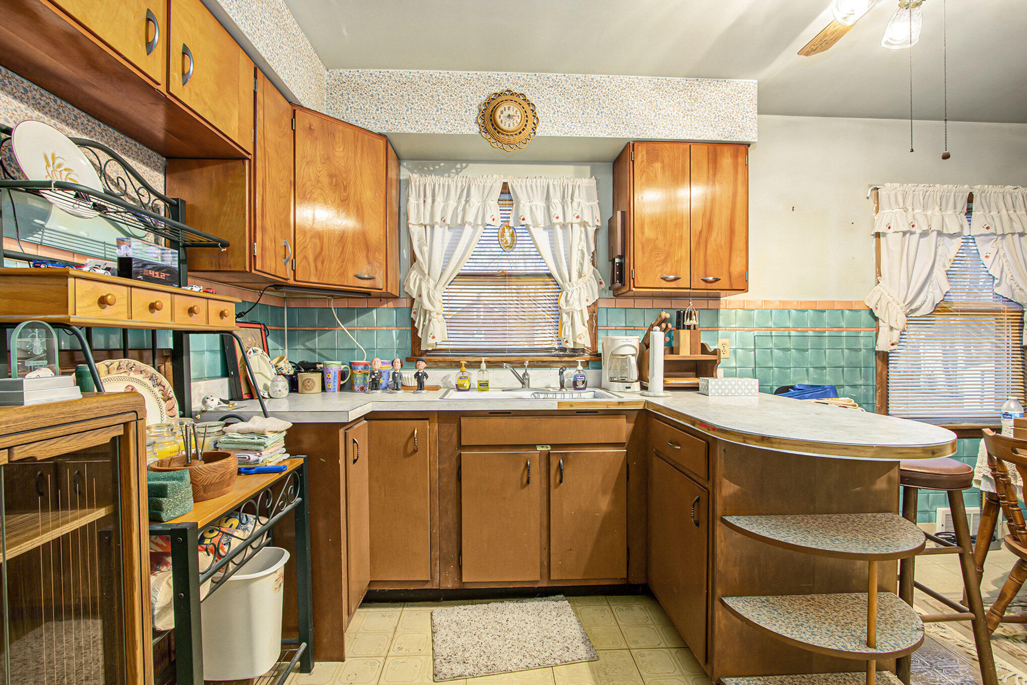 1027 Spruce Street Hammond, IN 46324 - Photo 7 of 17 a kitchen with a sink and a stove top oven