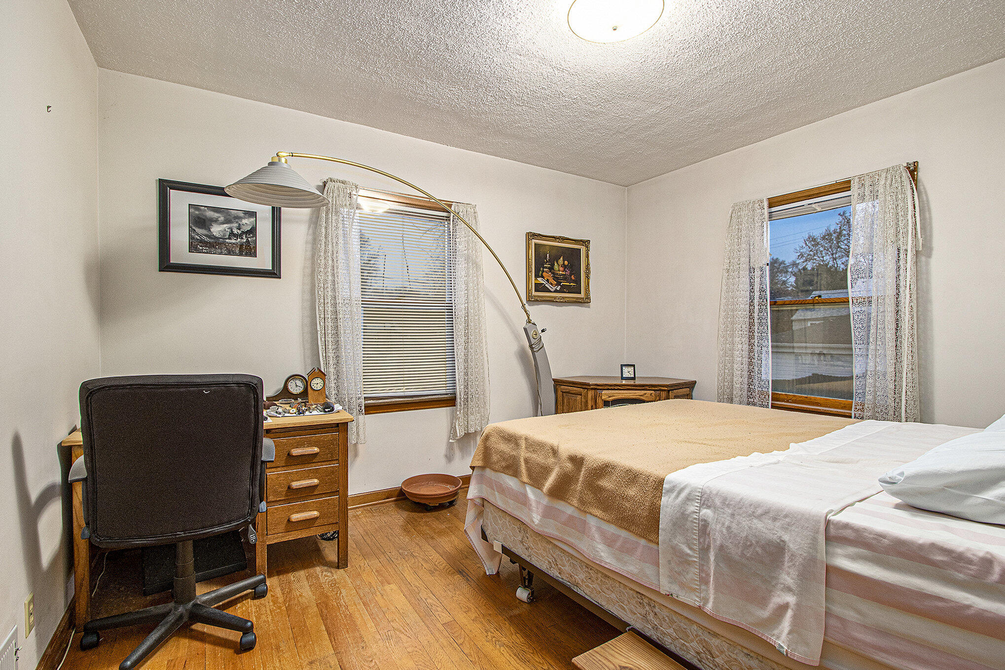 1027 Spruce Street Hammond, IN 46324 - Photo 9 of 17 a bedroom with a bed and a chair