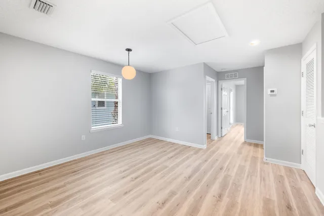 a view of an empty room with a window