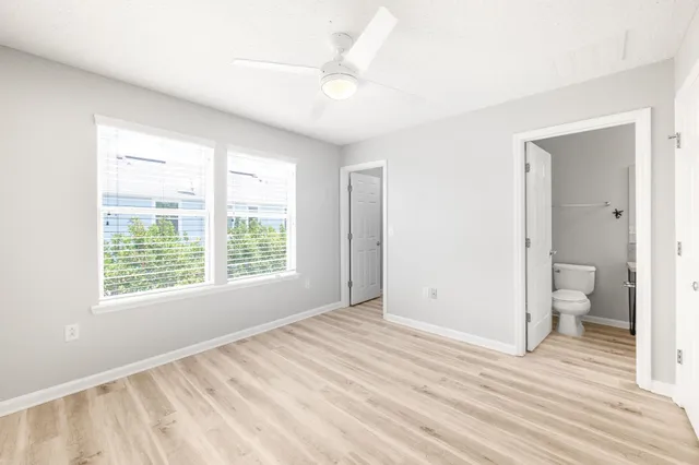 a bathroom with a sink toilet and mirror