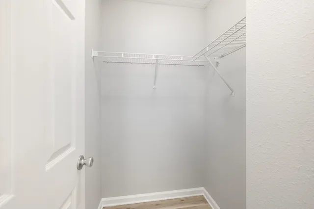 a bathroom with a sink toilet vanity and shower
