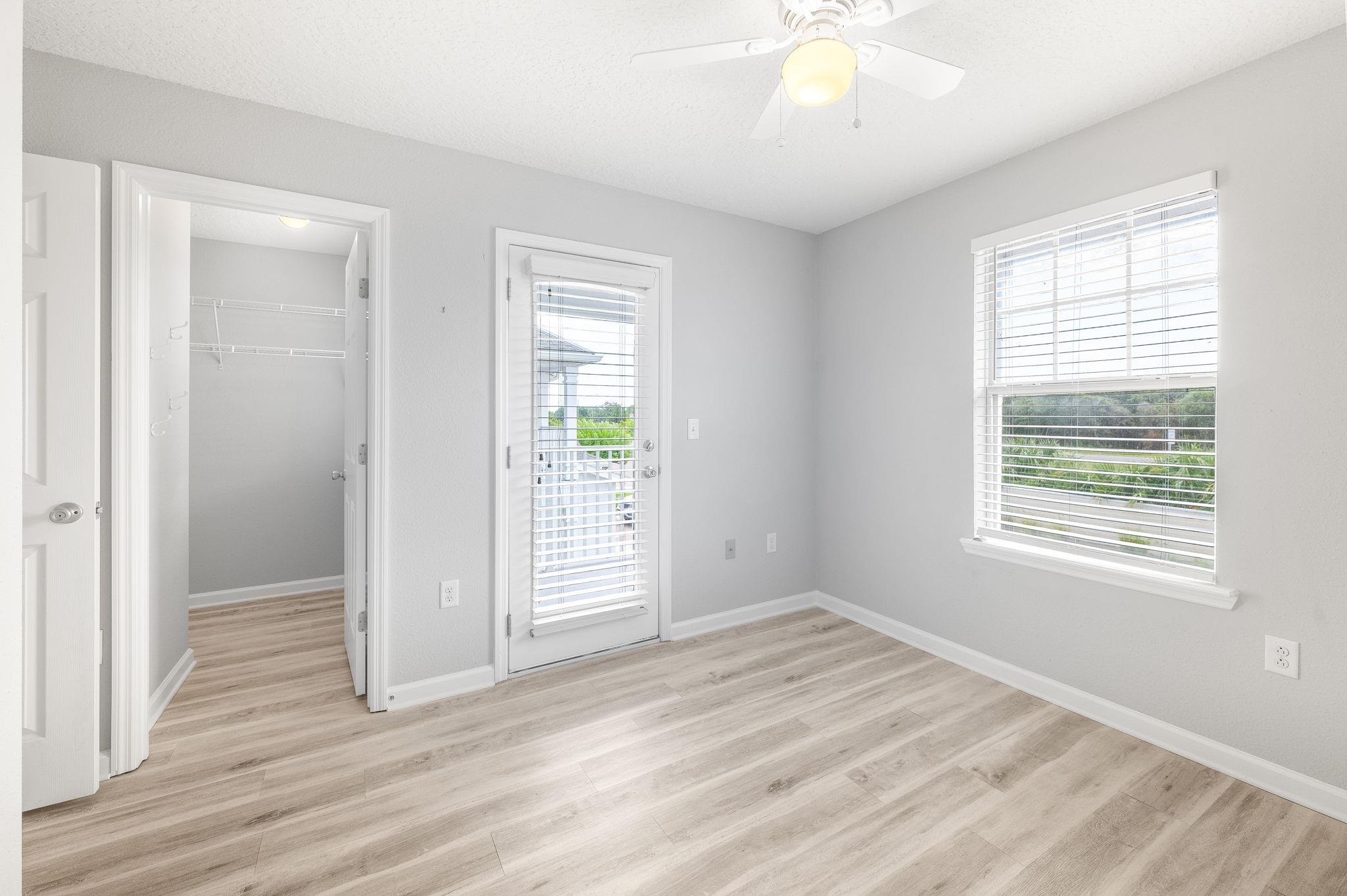113 Islander Drive St. Augustine, FL 32080 - Photo 25 of 35 a view of an empty room with wooden floor and a window