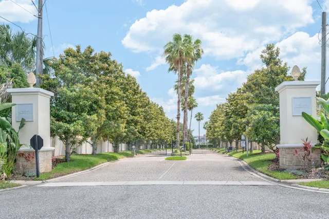 a view of a house with pool and sitting area