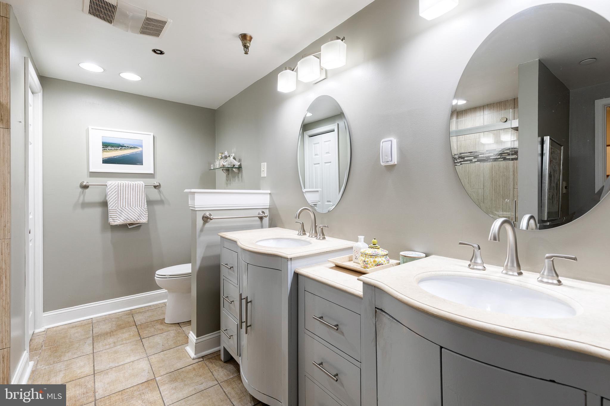 2331 Old Court Road, Unit 307 Baltimore, MD 21208 - Photo 12 of 35 a bathroom with a sink and a mirror