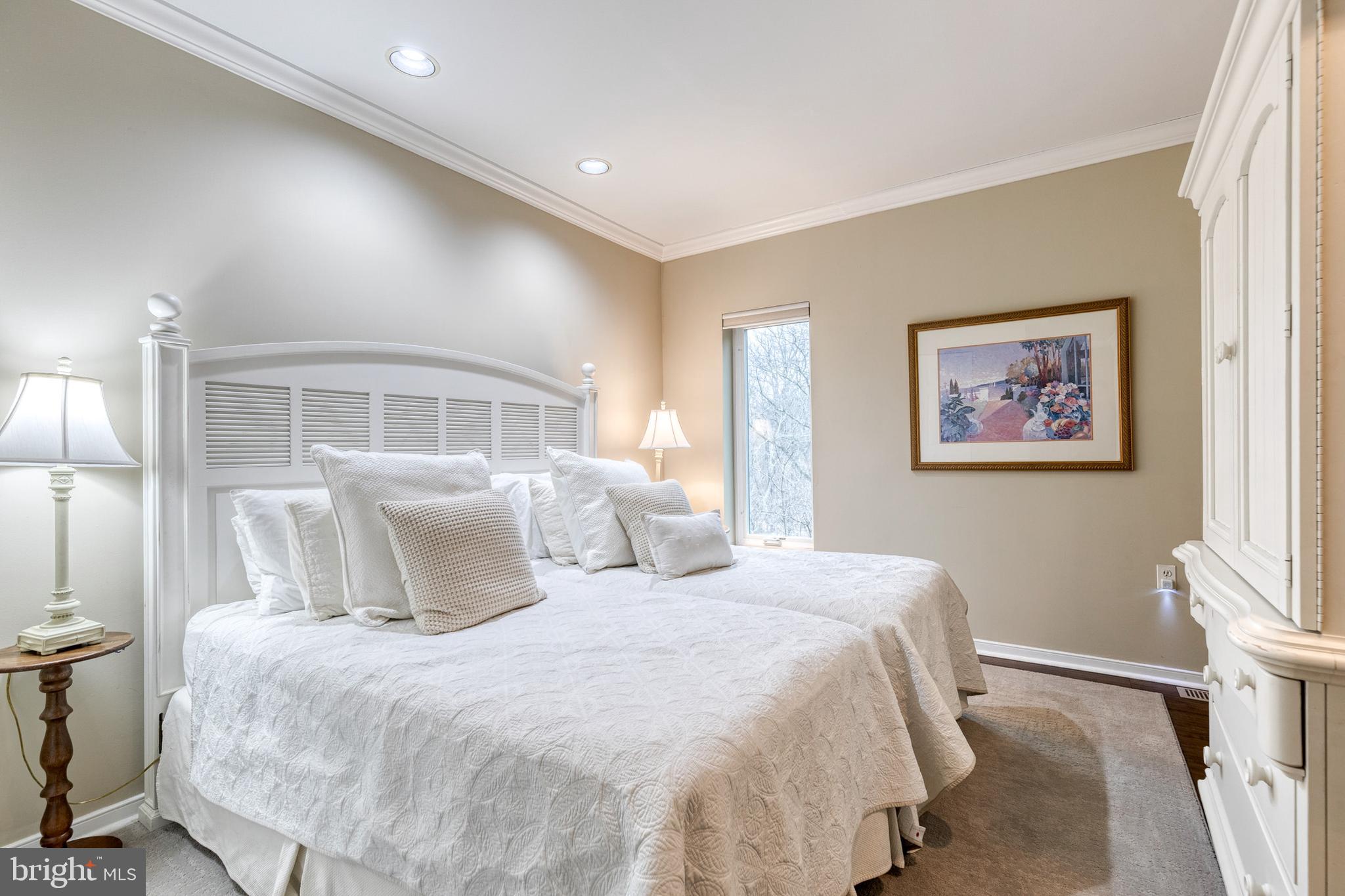 2331 Old Court Road, Unit 307 Baltimore, MD 21208 - Photo 14 of 35 a bedroom with a large bed and a window