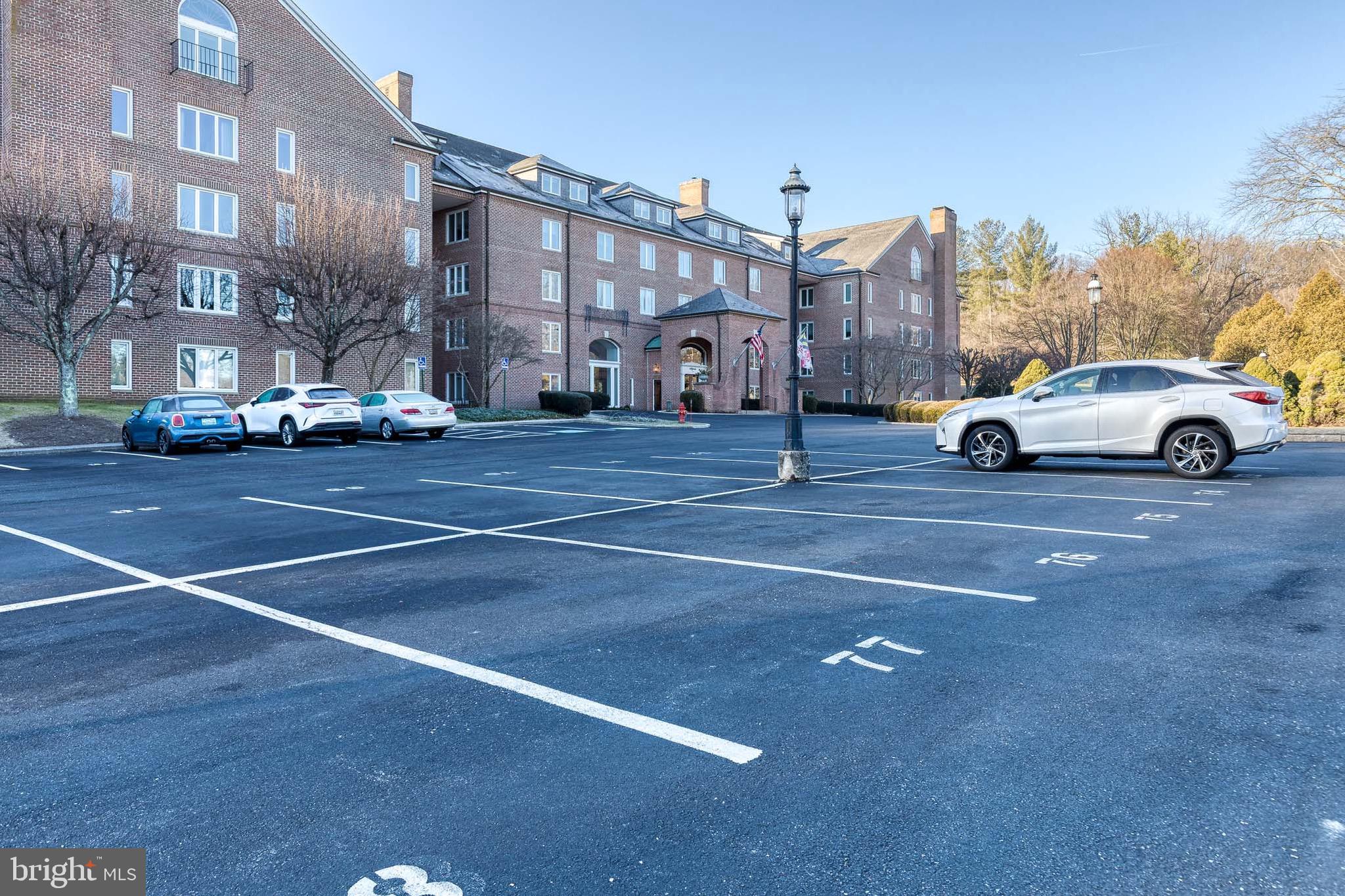 2331 Old Court Road, Unit 307 Baltimore, MD 21208 - Photo 21 of 35 a view of street with parked cars
