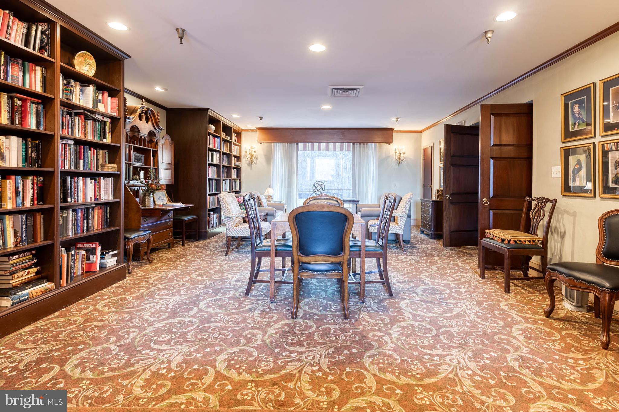 2331 Old Court Road, Unit 307 Baltimore, MD 21208 - Photo 25 of 35 a living room with furniture a bookshelf and a bookshelf