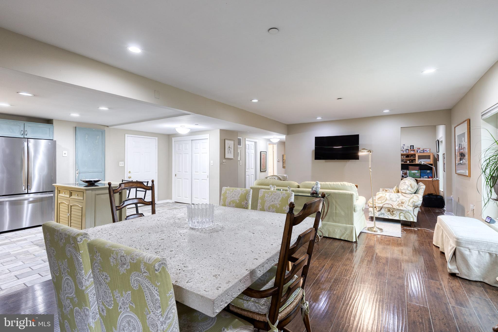 2331 Old Court Road, Unit 307 Baltimore, MD 21208 - Photo 6 of 35 a dining room with furniture and wooden floor