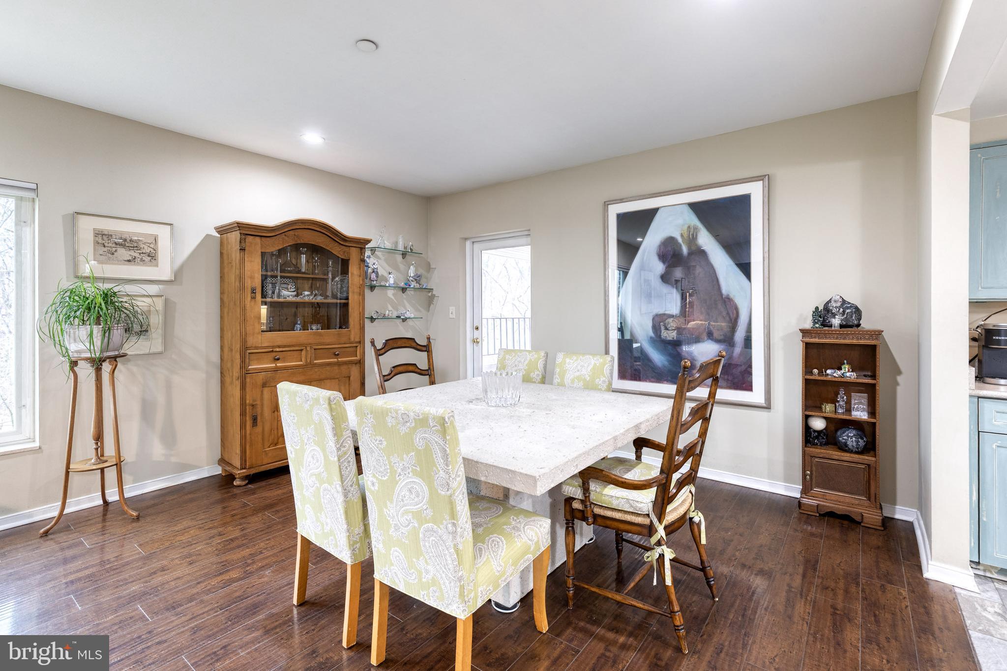 2331 Old Court Road, Unit 307 Baltimore, MD 21208 - Photo 7 of 35 a view of a dining room with furniture and wooden floor