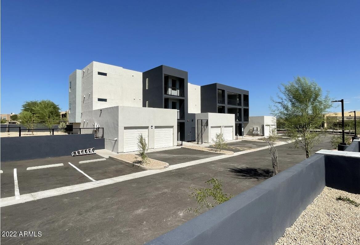 12412 North Saguaro Boulevard, Unit 303 Fountain Hills, AZ 85268 - Photo 1 of 48 a view of a patio with couches and a fire pit