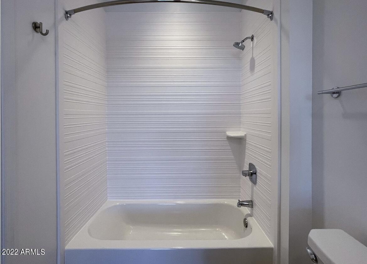 12412 North Saguaro Boulevard, Unit 303 Fountain Hills, AZ 85268 - Photo 30 of 48 a close up of a bathtub in a bathroom