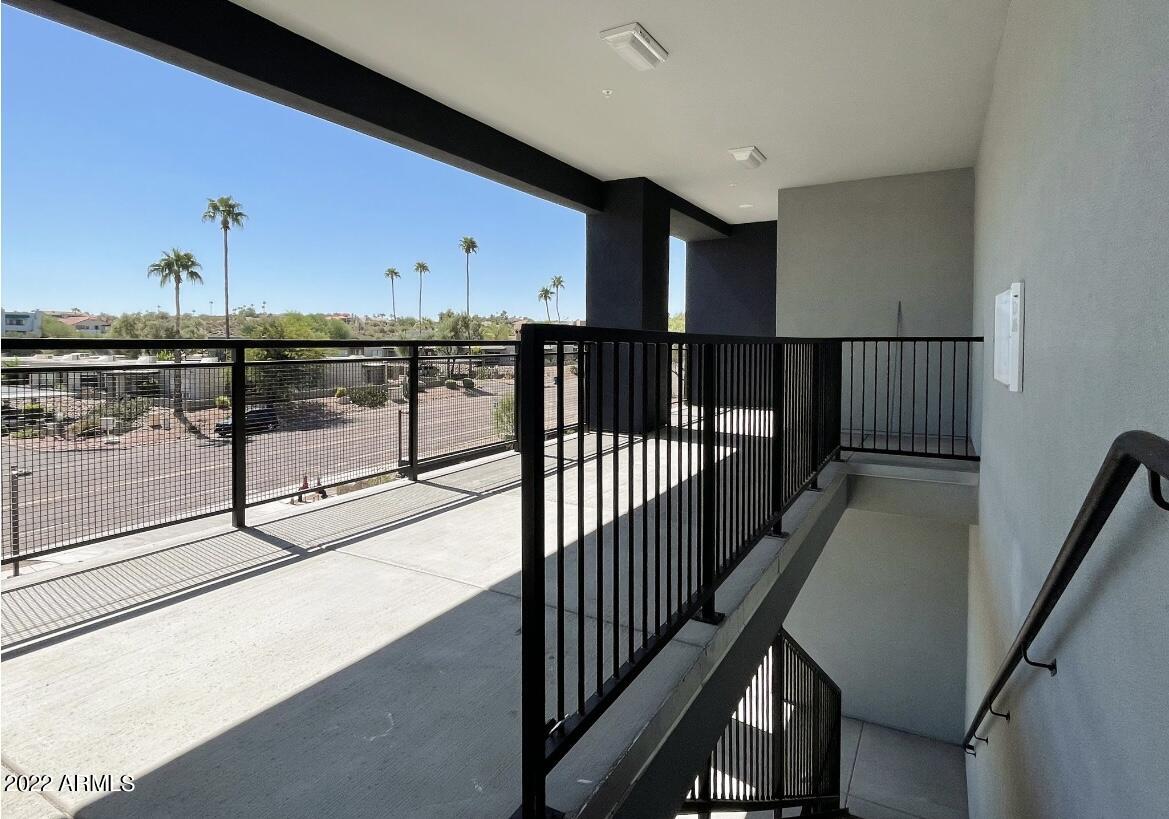 12412 North Saguaro Boulevard, Unit 303 Fountain Hills, AZ 85268 - Photo 44 of 48 a view of staircase with wooden floor and stairs