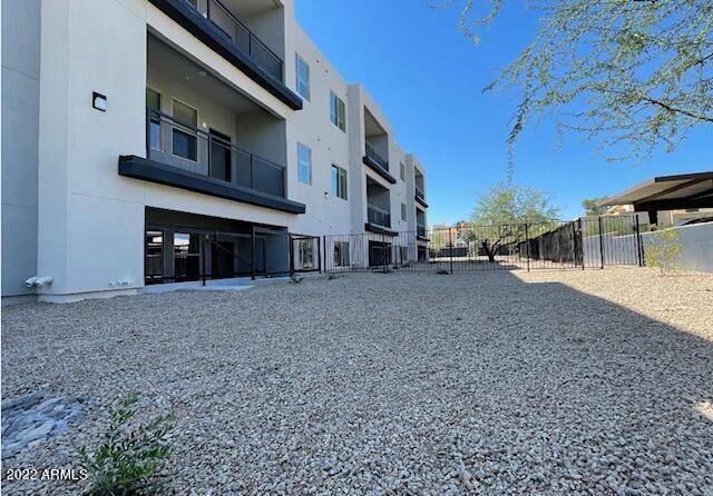 12412 North Saguaro Boulevard, Unit 303 Fountain Hills, AZ 85268 - Photo 7 of 48 a view of a house with a yard