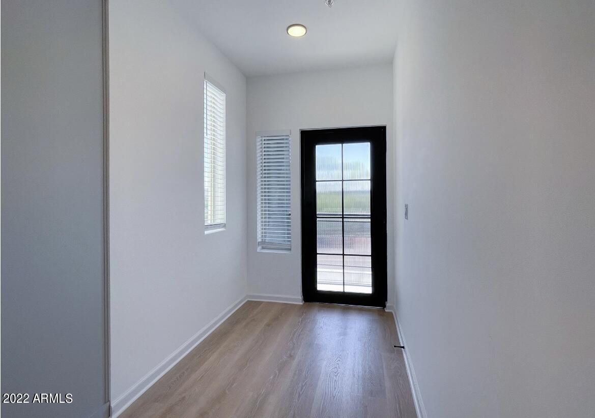 12412 North Saguaro Boulevard, Unit 303 Fountain Hills, AZ 85268 - Photo 10 of 48 wooden floor in an empty room with a window