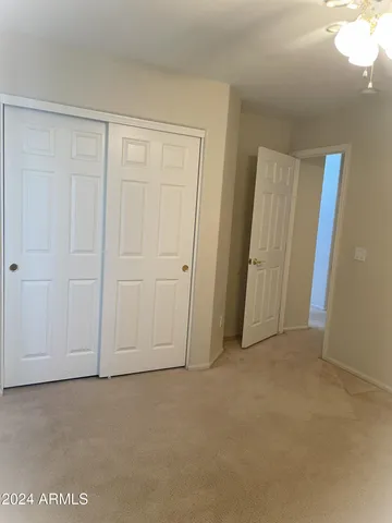 a view of an empty room and entryway