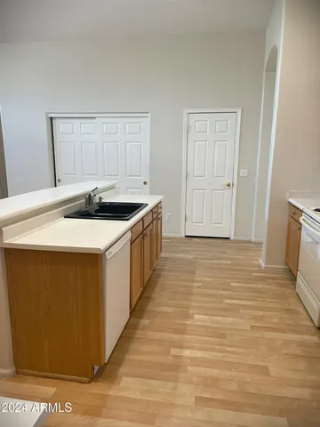 a kitchen with a sink and cabinets