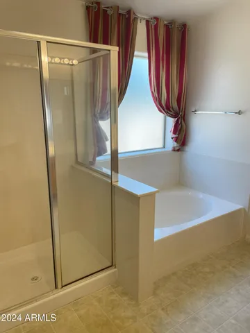 a view of walk in closet with window