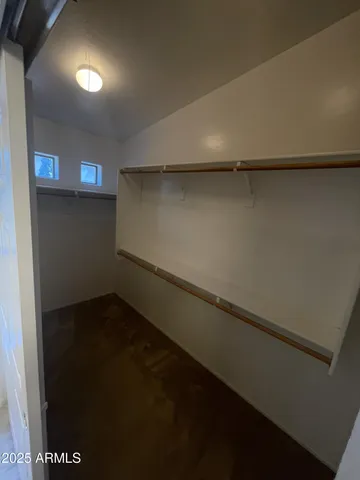 a view of an empty walk in closet