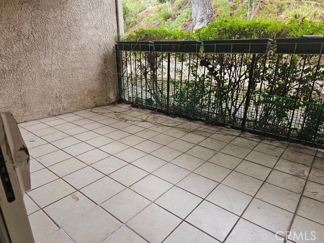 7754 Vía Rosa Maria Burbank, CA 91504 - Photo 13 of 13 a balcony with a bench in wooden floor