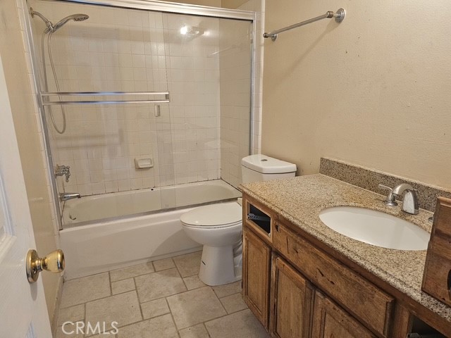 7754 Vía Rosa Maria Burbank, CA 91504 - Photo 9 of 13 a bathroom with a granite countertop sink toilet and shower