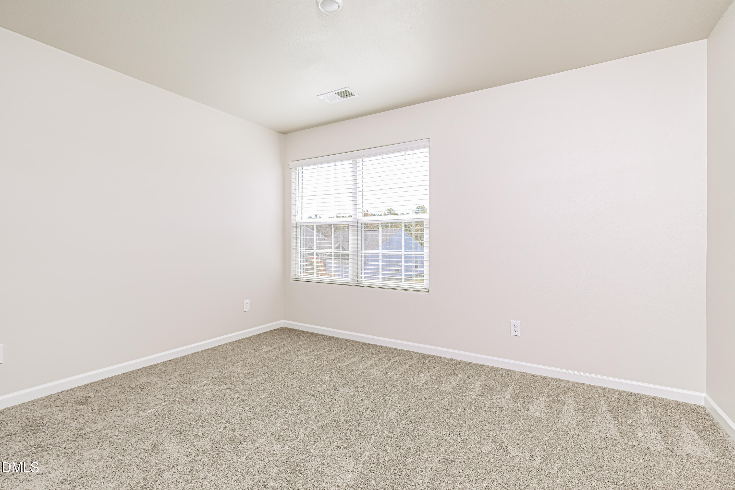 135 Shallow Drive Youngsville, NC 27596 - Photo 12 of 17 an empty room with windows