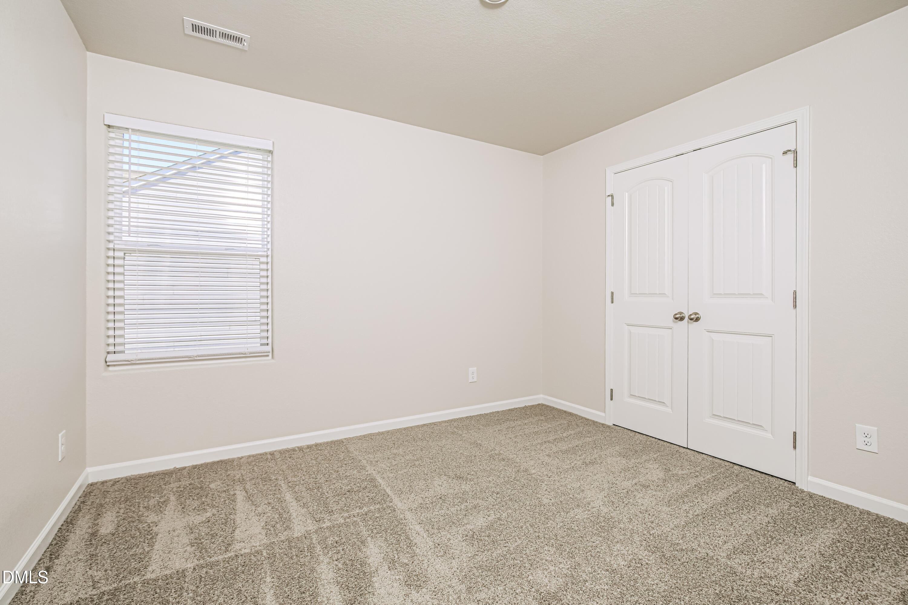 135 Shallow Drive Youngsville, NC 27596 - Photo 13 of 17 a view of an empty room with a window