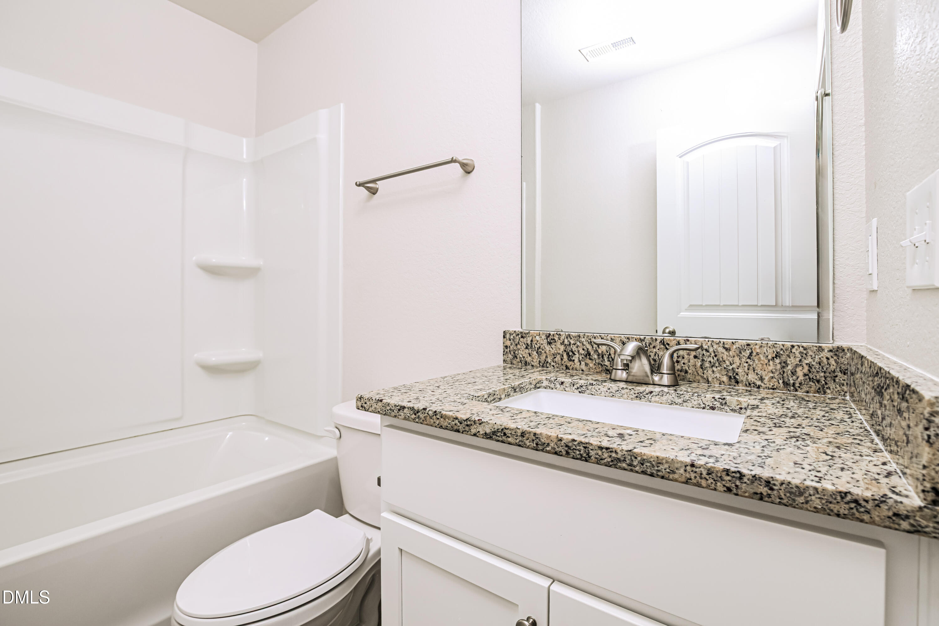 135 Shallow Drive Youngsville, NC 27596 - Photo 14 of 17 a bathroom with a granite countertop tub sink and mirror