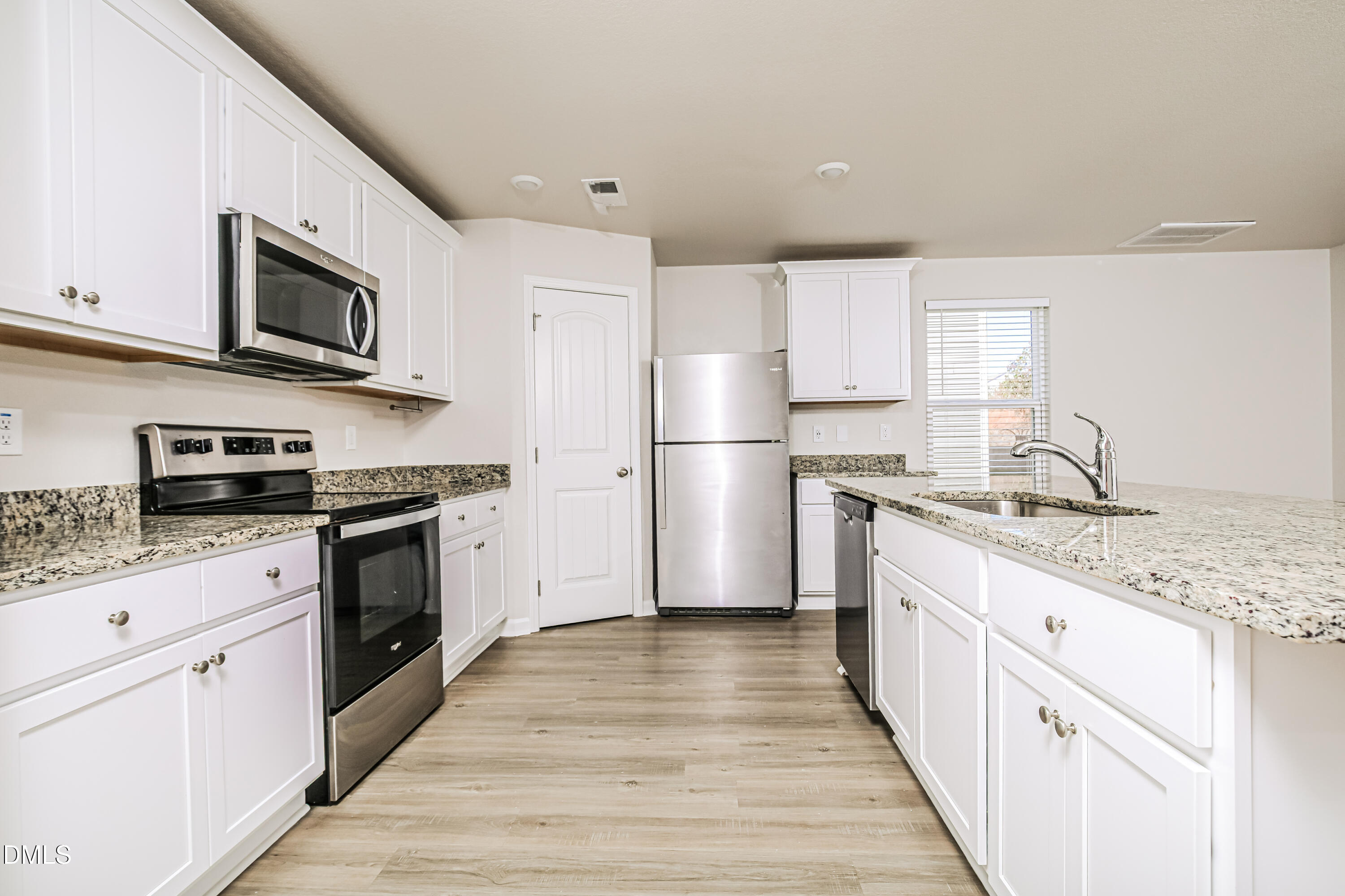 135 Shallow Drive Youngsville, NC 27596 - Photo 6 of 17 a kitchen with granite countertop a refrigerator stove top oven and sink