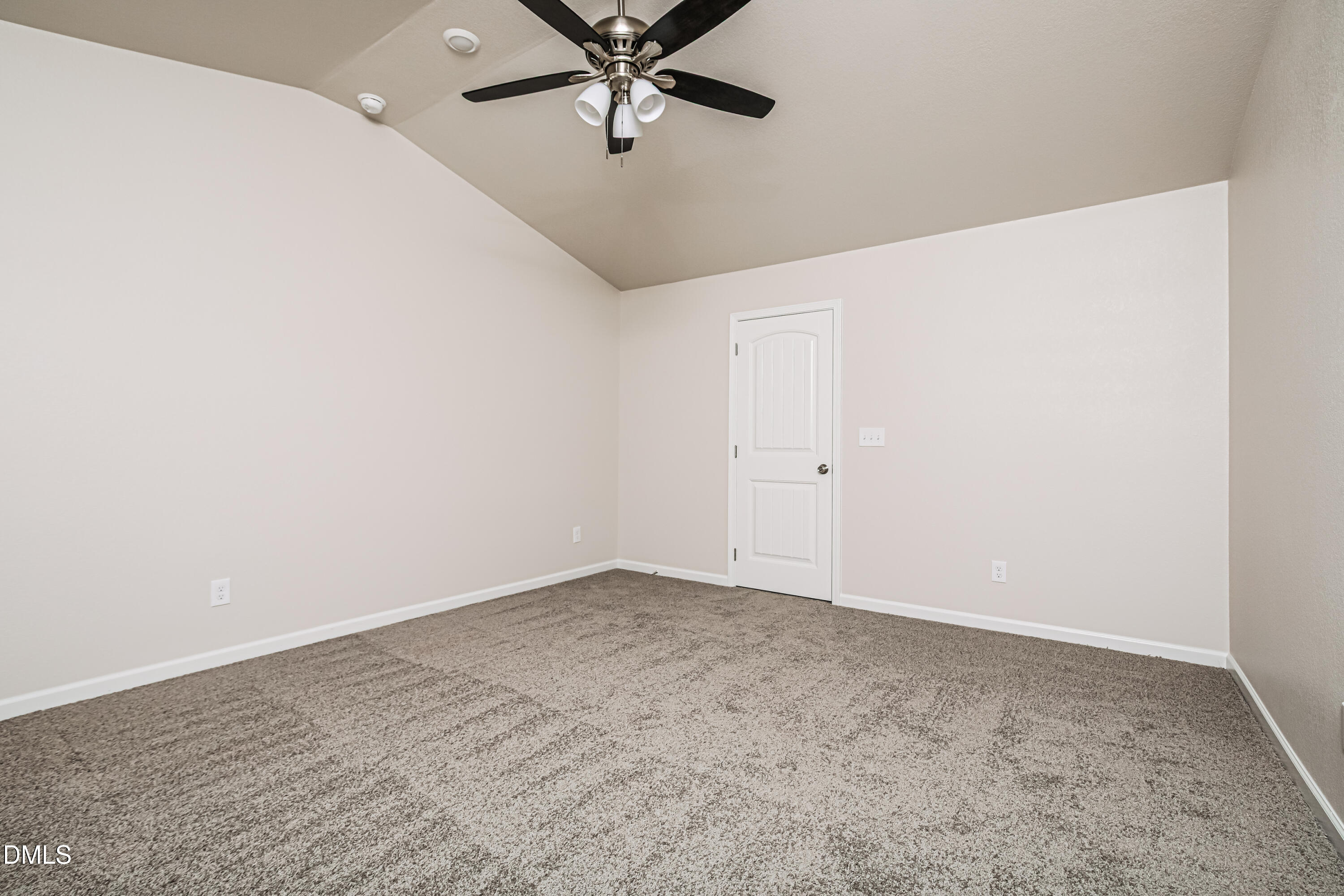 135 Shallow Drive Youngsville, NC 27596 - Photo 8 of 17 an empty room with a ceiling fan and carpet