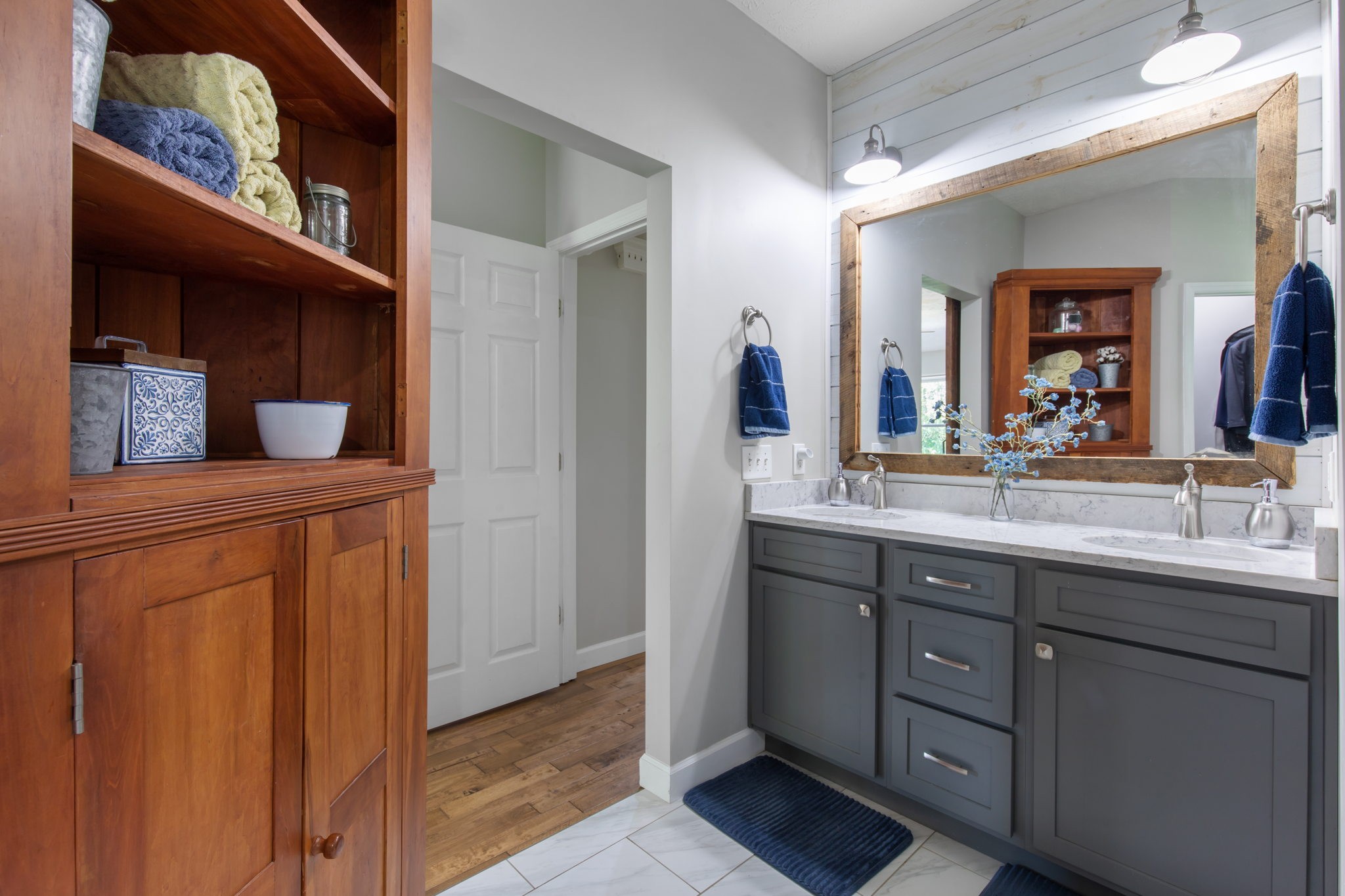 3161 Little Rock Road Eagleville, TN 37060 - Photo 17 of 56 a bathroom with a double vanity sink and a mirror
