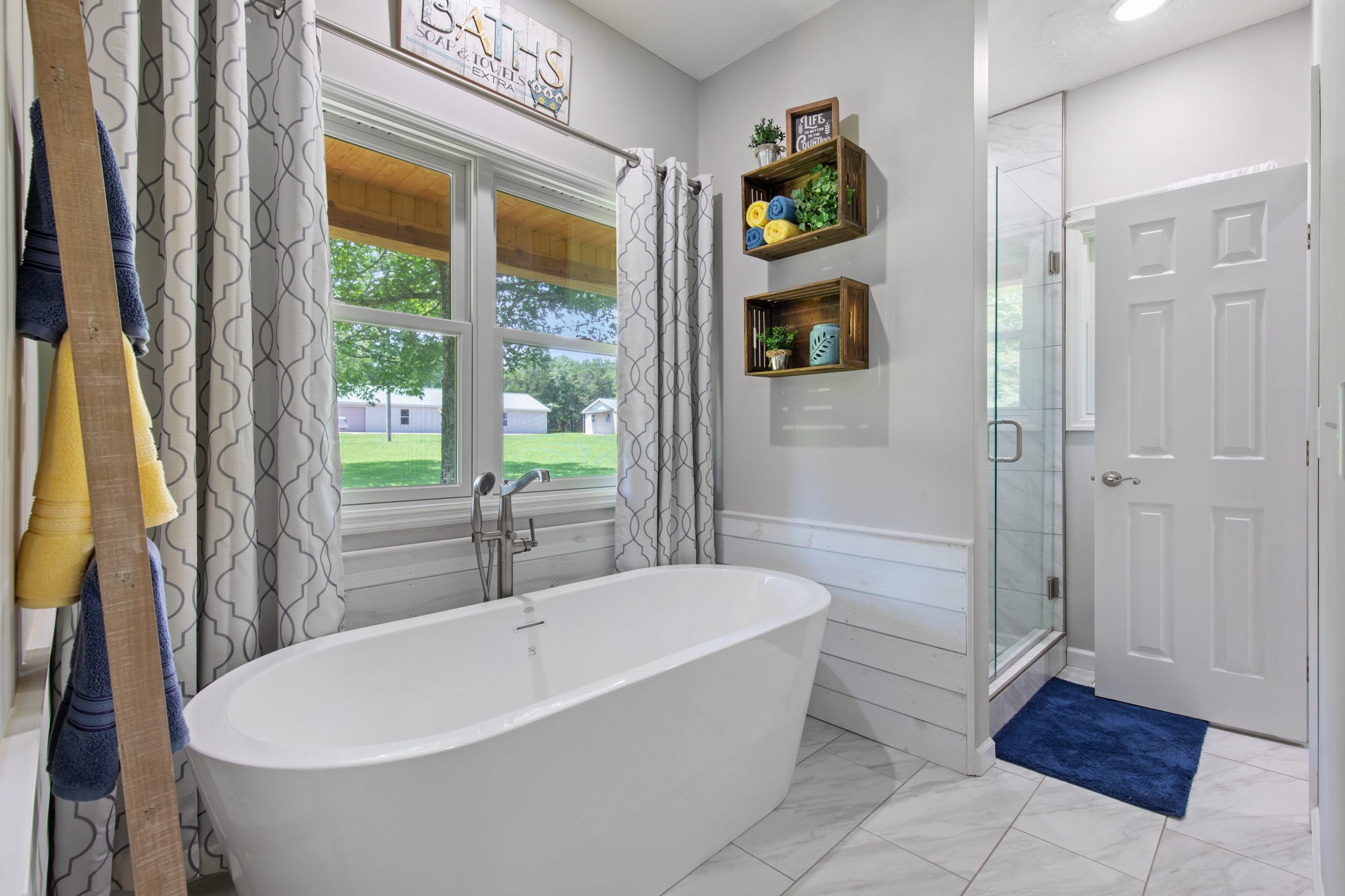 3161 Little Rock Road Eagleville, TN 37060 - Photo 18 of 56 a white bath tub sitting in a bathroom next to a window
