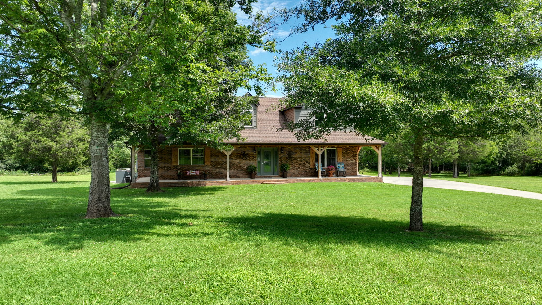 3161 Little Rock Road Eagleville, TN 37060 - Photo 2 of 56 a front view of a house with a garden