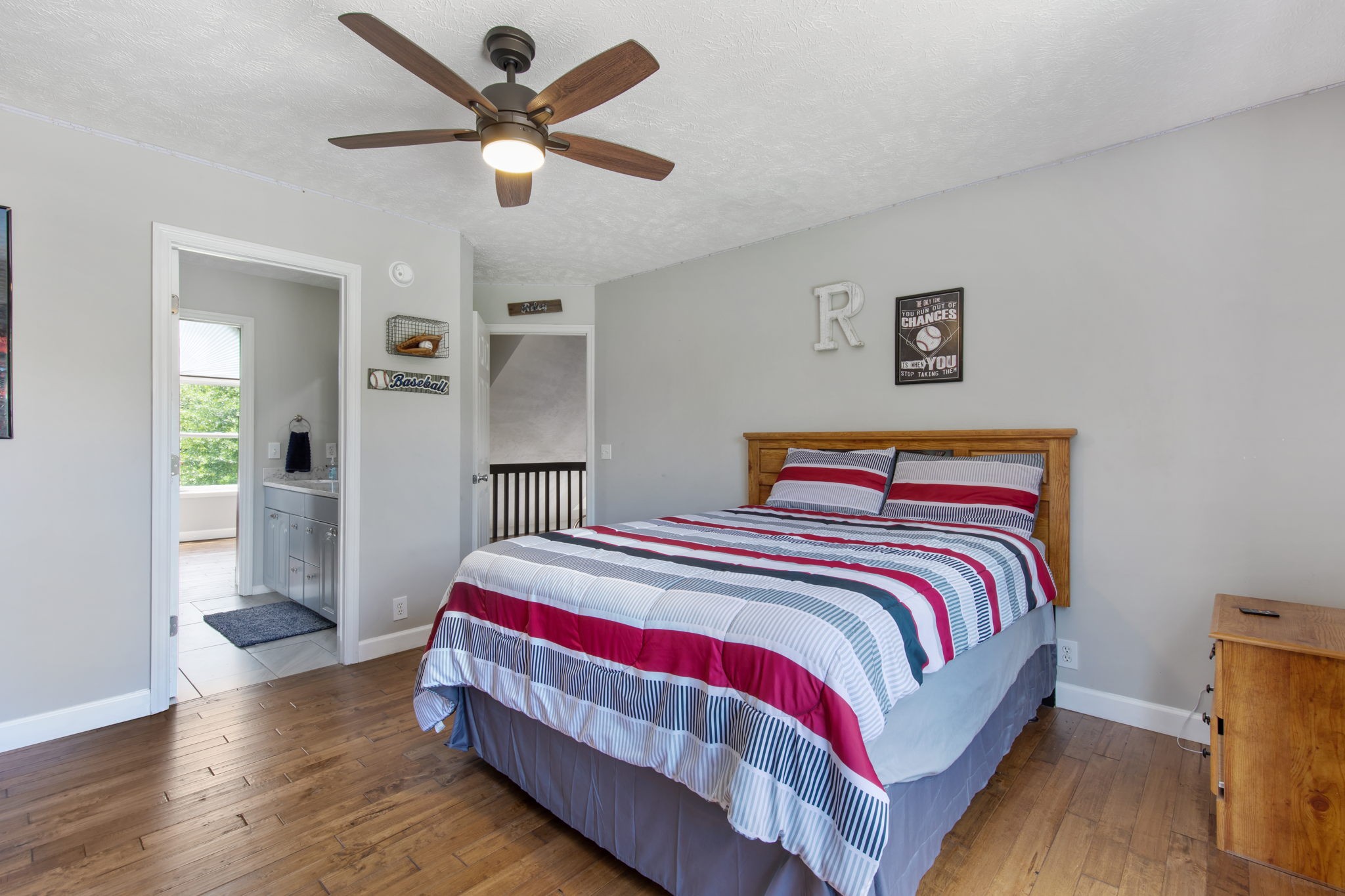 3161 Little Rock Road Eagleville, TN 37060 - Photo 24 of 56 a bedroom with a bed and a chandelier