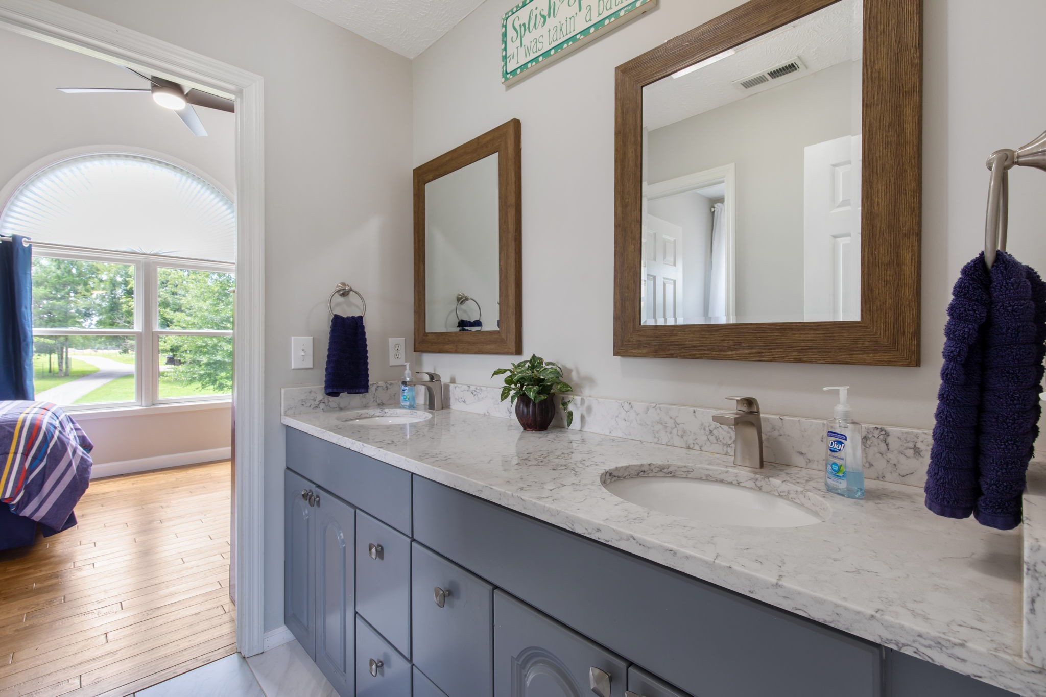 3161 Little Rock Road Eagleville, TN 37060 - Photo 26 of 56 a bathroom with a sink double vanity and a mirror