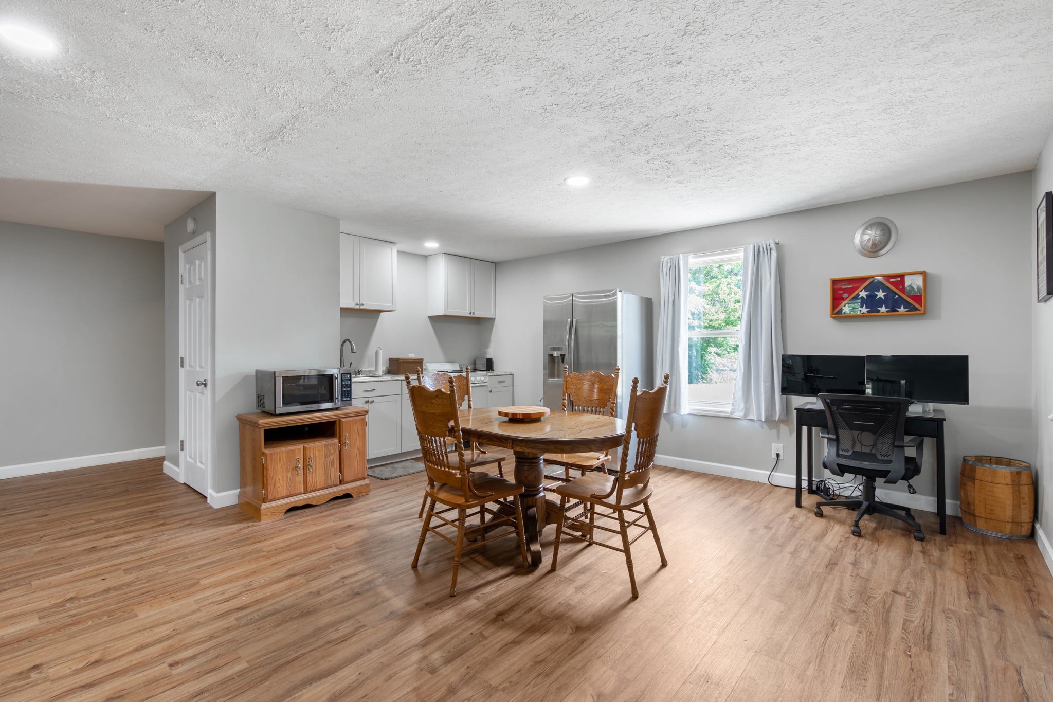3161 Little Rock Road Eagleville, TN 37060 - Photo 39 of 56 a view of a dining room with furniture a rug and wooden floor