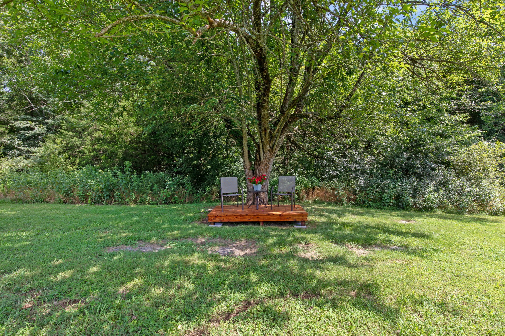 3161 Little Rock Road Eagleville, TN 37060 - Photo 42 of 56 a view of a backyard with table and chairs