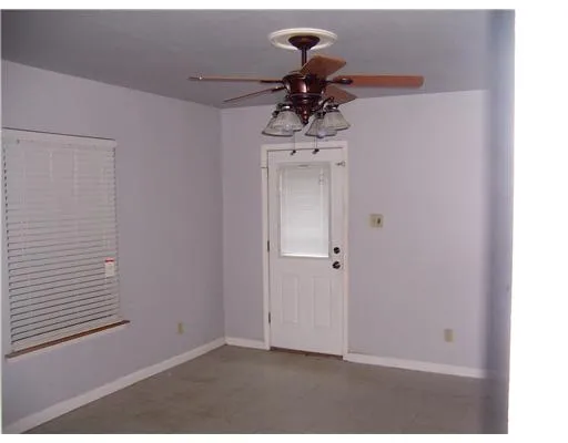 a view of a chandelier fan in a room