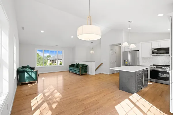 a view of kitchen with furniture and wooden floor