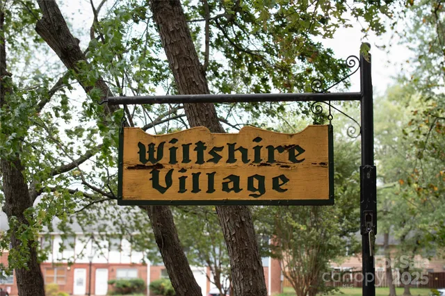 a sign on the side of a tree