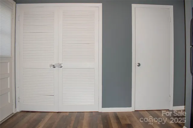 a kitchen with stainless steel appliances a stove microwave and sink