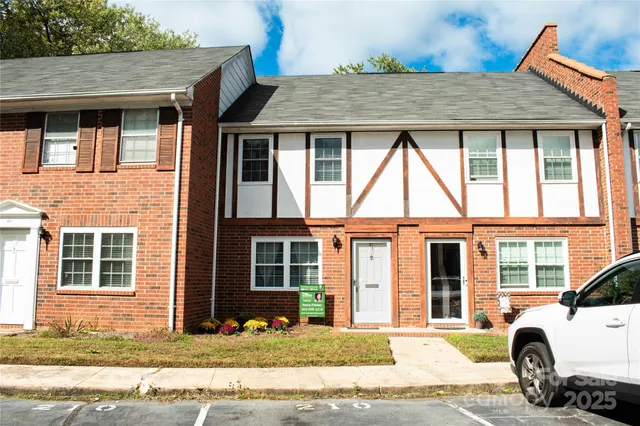 a front view of a house with a yard outdoor seating and barbeque oven