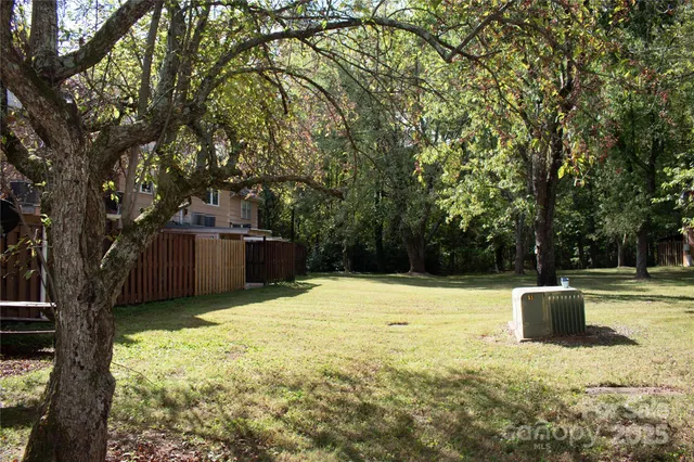 a view of a wooden door with a backyard