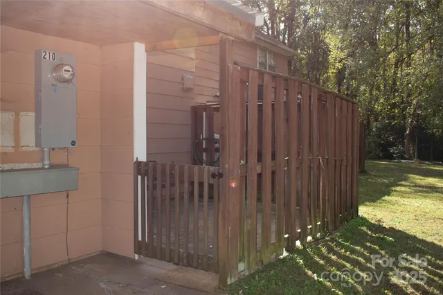 a view of a house with a wooden door and a glass door