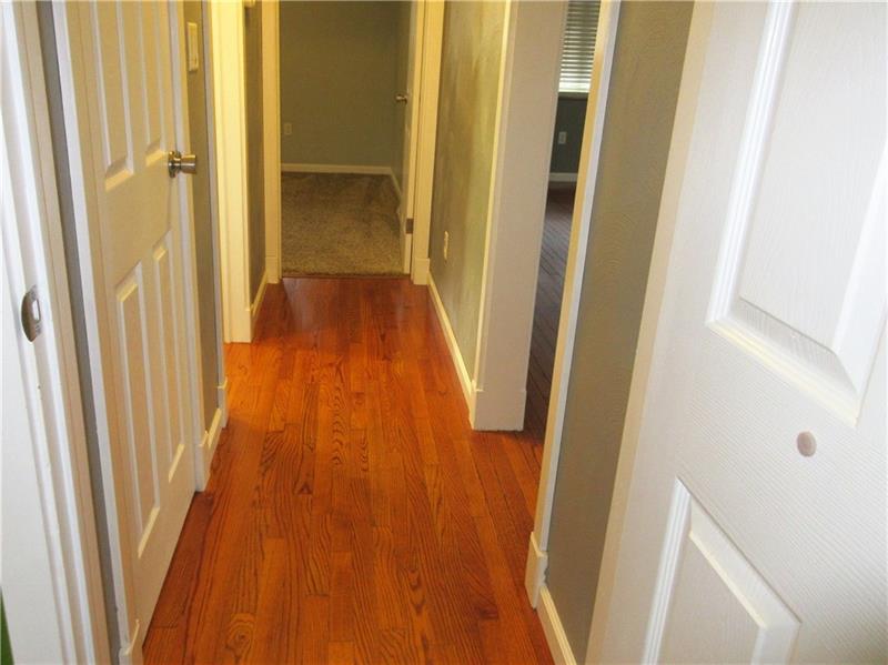 724 North Pike Road Cabot, PA 16023 - Photo 13 of 25 Hallway leading to bedrooms and bathroom.
