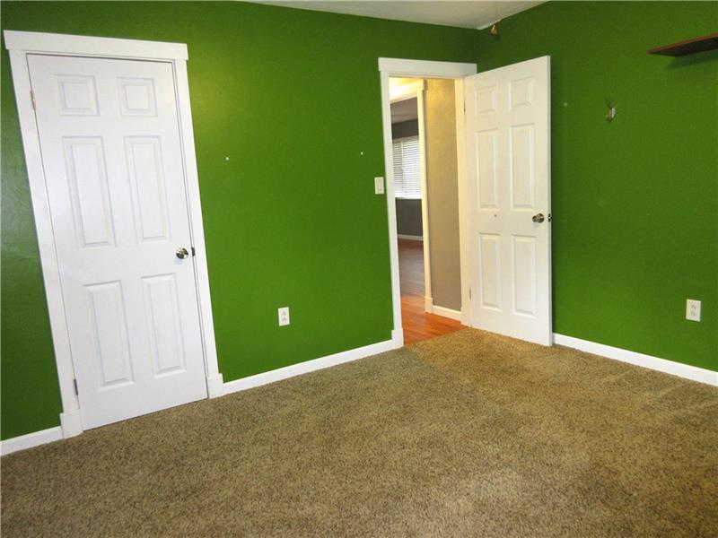 724 North Pike Road Cabot, PA 16023 - Photo 14 of 25 Bedroom two features a new lighted ceiling fan and plaster walls.